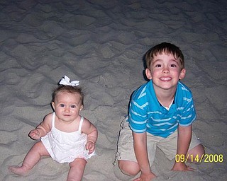 Here are Andrew Cvetkovic, 4 1/2, and his sister, Alexandra, 6 months, during their first visit to the beach in September at Myrtle Beach. They are the children of Nikki and Matthew Cvetkovic of Austintown.