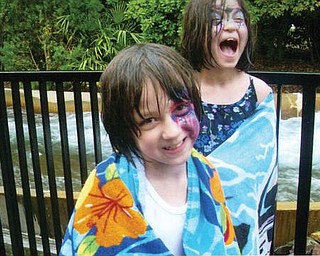 Autumn and Amber Murzda of Hubbard are enjoying there first water ride at Bush Gardens in July.