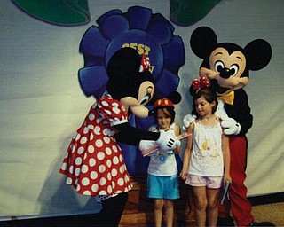 Autumn and Amber Murzda of Hubbard met Minnie and Mickey Mouse at Disney World in Florida in July.