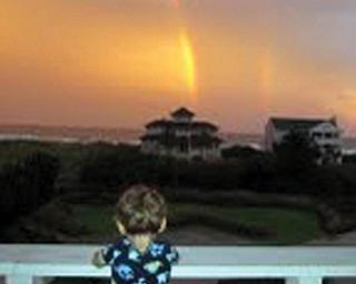 Recently Anthony and Nora Pilolli of Boardman spent a week on Figure Eight Island, N.C. with the family of daughter and son-in-law, Sherri and Tom Meyer of Lynchburg, Va. This is a picture of their grandson, Oliver Meyer, checking out the rainbows after a rainy day.