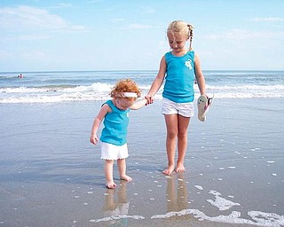 Karley, 4, and Kira 17 months, McAfoose, daughters of Kimberly and Gary McAfoose of McDonald, made their first trip to the ocean.