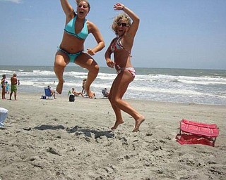 Tricia Bettura , left, Rachel Melewski of Canfield are jumping with joy at Myrtle Beach!