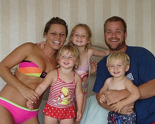 On their first family vacation in August in Ocean City, Md., are Brandon and Jackie Bower of Austintown and their children, Brelyn, 4, and Kaelyn and Hadyn, 2.
