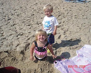 Kaelyn and Hadyn Bower, 2, children of Brandon and Jackie Bower of Austintown, enjoy their first trip to the beach at Ocean City, Md.