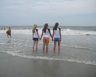 'More backs in Myrtle Beach' shows, from left, Laura Tinkler of Canfield High School, Leah Callaway of Boardman High School, and Natalie DeGenova of Poland High School.