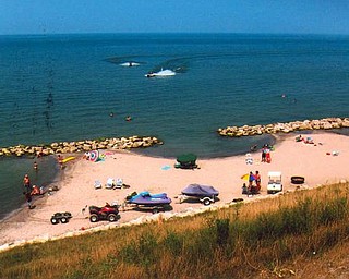 Vacationers are having fun at a new beach on Olive Drive, Saybrook, at Lake Erie. Photo provided by Howard and Suzie Hallas of Poland.