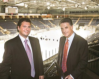 ALL IN THE FAMILY: Alex Zoldan, president of the Youngstown Phantoms hockey team, left, joins his father, Bruce Zoldan, owner of the team, at the Covelli Centre. The junior hockey league team’s season opener is Saturday at the Youngstown arena.