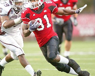 YSU's Donald Jones eludes Terian Washington of Missouri during 1 rst half action Saturday. wd lewis