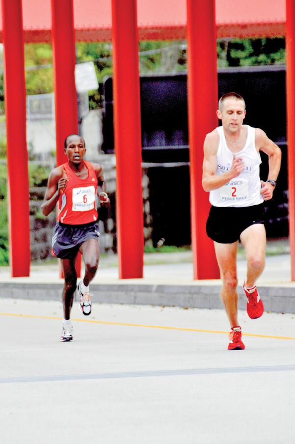 The Vindicator/Dan Shieldson Spring Commons Bridge as Matt Folk begins to move aheadfor the finish of the Peace Race. 