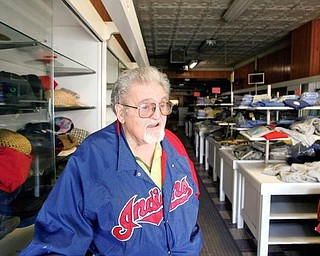 MEMORIES: Nick Noviello shares some of his memories in the  Bridge Street store in Struthers where he’s worked for 60 years. The store and its inventory will be auctioned Thursday.