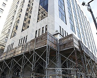 RENOVATIONS: Scaffolding is set up outside the National City building in downtown Youngstown. National City Bank was bought out by PNC Bank last year, and the building’s signage is scheduled to be replaced in the coming months.