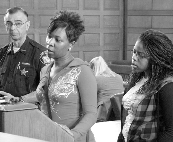LIFE IN PRISON: Brittnay McCoy, left, and her sister, Chelise McCoy, took turns speaking about Eugene Cumberbatch, who was sentenced to life in prison for his role in the April 13 deaths of their brother Lloyd McCoy Jr., 11, and Marvin Chaney, 26. Deputy Nick Veri is pictured at far left.