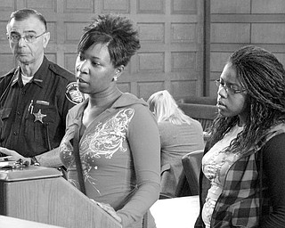 LIFE IN PRISON: Brittnay McCoy, left, and her sister, Chelise McCoy, took turns speaking about Eugene Cumberbatch, who was sentenced to life in prison for his role in the April 13 deaths of their brother Lloyd McCoy Jr., 11, and Marvin Chaney, 26. Deputy Nick Veri is pictured at far left.
