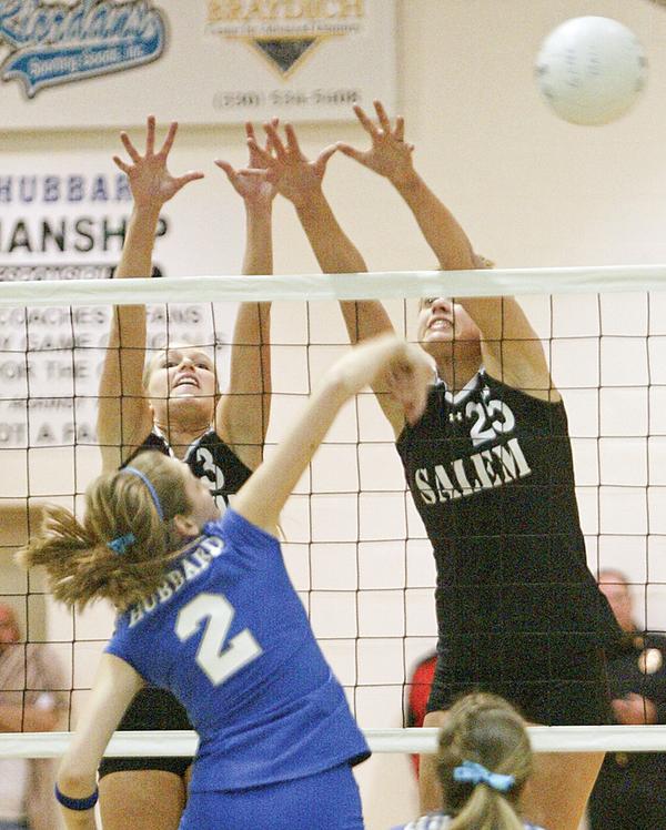 Hubbard's Lexi Starheim slips a shot past Salems Olivia Mitchley, left, and Amy Scullion.