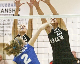Hubbard's Lexi Starheim slips a shot past Salems Olivia Mitchley, left, and Amy Scullion.