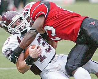 Missouri QB Cody Kirby is brought down by YSU's Taylor Hill during first half action Saturday.