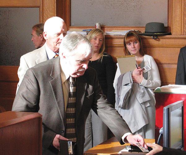 ONE MORE CHANCE: Tom Mahoney, former Trumbull County Department of Job and Family Services director, hands the bailiff his driver’s license in Trumbull County Common Pleas Court. Judge John M. Stuard sentenced Mahoney to four years’ probation for his conviction on a cocaine-possession charge.