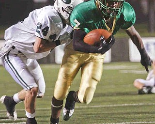 The Vindicator/Lisa-Ann Ishihara--- Irish Chris Collins (7) and Central Catholic's Dillon Stertzbach (24) during the first quarter at Stambaugh Stadium Friday October 9, 2009