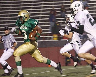 The Vindicator/Lisa-Ann Ishihara--- Irishman Dawalyn Harper (3) outruns Central Catholic's Jack Anderson (25) and Dylan Dehoff (19) at Stambaugh Stadium to score a touchdown in the first quarter Friday October 9, 2009