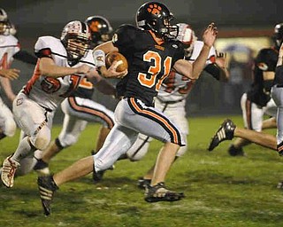 Springfield's (31) Jason Horn looks for running room against Columbiana during their game on Friday night. Photo/Mark Stahl