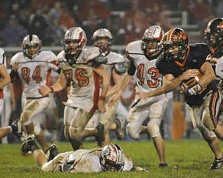 Springfield's (49) JIm Zubick looks for running room against Columbiana during their game on Friday night. Photo/Mark Stahl