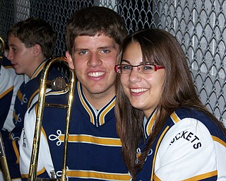 Lowellville senior trombone players Joe Harris and Amber Ivack take a break during third quarter at Lowellville's victory over Jackson Milton.