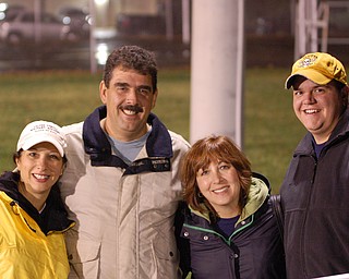 Nancy Grapevine, Tom Harkelrode, Lisa Perry and Chris Crilley take a break while cheering on the Lowellville Rockets at Sebring.