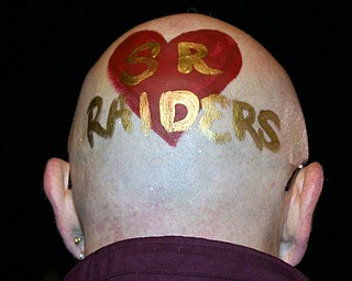 "South Range Band Booster Officer Mr. Dieger show his Raider spirit.
The painting is done by the flagline members."