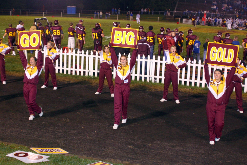 "Go Big Gold" say the South Range cheerleaders on the sideline.