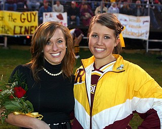 "Jesse Heck poses with fellow South Range cheerleader Dominique Bishop
who had the night off from cheering to be on 2009 Football Homecoming
Court."