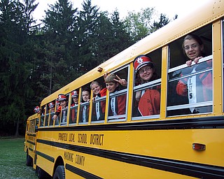 Waiting for the Game: Members of the Springfield Local Marching Band wait to get off the bus at the South Range Stadium.