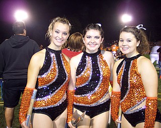 Born to Twirl: The Springfield Local Majorettes are all smiles before the half time show at South Range. From the left: Rebecca Platt, Amanda Dicks, and Amanda Lehnerd.
