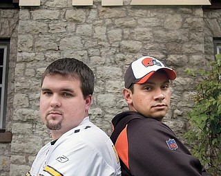 FRIENDLY RIVALRY: Joe Rupert, left, and Mason Shadduck, best friends and members of the Alpha Phi Delta fraternity, stand side-by-side in front of their house. The two are fans of the Pittsburgh Steelers and Cleveland Browns, respectively, and are anticipating the game between the teams Sunday.