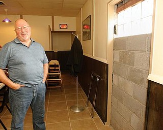 CRIME FIGHTER: Bob DeVicchio, owner of Bogey’s Bar and Grill in Coitsville, is doing everything he can to prevent another break-in at his business. He blocked up the back entrance to the building, where burglars got in earlier this month.