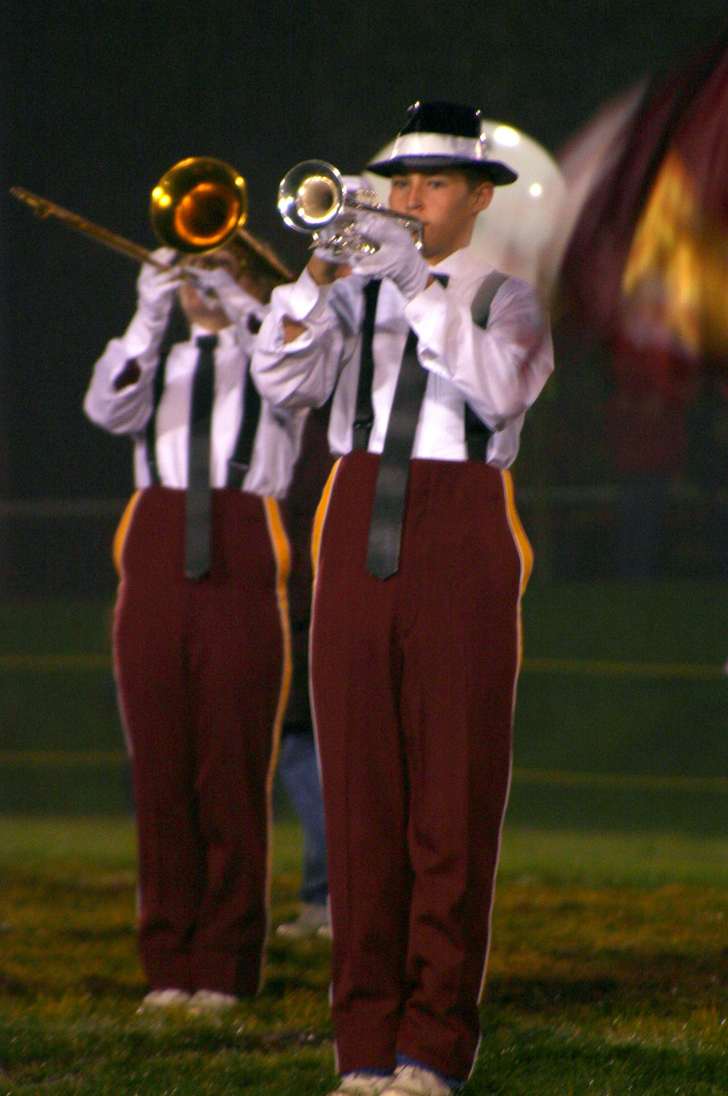"Senior Clay Proust plays his trumpet to "Zoot Suit Review" in the
Friday's band show by South Range Raider Band."