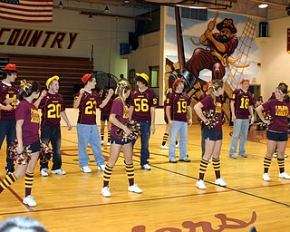"South Range Senior football players help the Senior cheerleaders with
a cheer at Friday's pep rally."