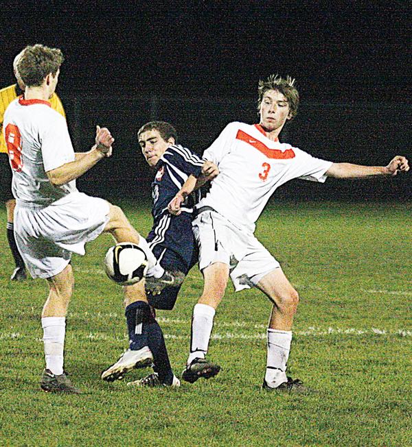 SOCCER - (3) Peter Nog ( ) of Howland tries to keep (11) away from the ball Wednesday night. - Special to The Vindicator/Nick Mays