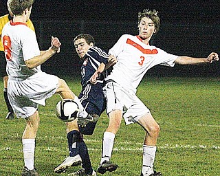 SOCCER - (3) Peter Nog ( ) of Howland tries to keep (11) away from the ball Wednesday night. - Special to The Vindicator/Nick Mays