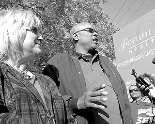 WE’RE NORTHSIDE FAMILY: Employees at Forum Health Northside Medical Center in Youngstown rally to protest layoffs at the hospital and their exclusion from the decision. “You don’t treat family like that,” said James Brown, right, a member of Service Employees International Union District 1199’s board of directors. Mary Ann Hupp, SEIU administrative organizer for Forum, left, said she hopes Forum’s new interim CEO “includes us in the planning.”
