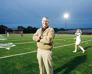Greg Cooper AD for Canfield  stands on the athletic field , behind him the band shell and the visiting stands... all have been redone in the last couple of years - robertkyosay