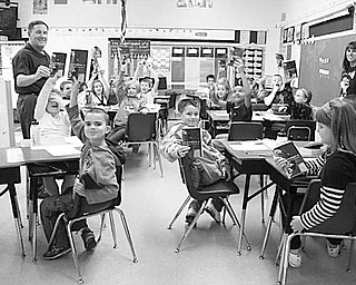 Special to The Vindicator
WORD POWER: Rotary International designated Oct. 10 Make a Difference Day, and the Austintown Club did its part. With the Green Team of Mahoning County, Rotary and Fitch Interact members cleaned up Kirk Road. In another project, club members distributed dictionaries to all third-grade classes at Lloyd, Lynn Kirk, Watson, Woodside, St. Joseph/Immaculate Heart, St. Christine and Jackson Milton elementary schools. More than 500 students received dictionaries to keep. Above, students in Mrs. Carchedi’s and Mrs. Billock’s class at Woodside Elementary happily show off their new dictionaries.