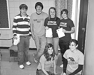 Special to The Vindicator
NO TRICKS, JUST TREATS: Thirty members of Fitch Interact Club, with help from the club sponsor, the Rotary Club of Austintown, created 100 treat bags to be distributed to children at the Hope House of Youngstown. Among those involved in providing the Happy Halloween treats for the youngsters are, from left, kneeling, Miranda DeFurio and Liana DeFurio, and in back, Brandon Rivello, Zarek Bell, Sara Guittar, and Mariah DeFurio. During a recent meeting Eric Bohr, manager of Walgreen’s on Meridian at Mahoning Avenue, challenged members to get involved in the Dec. 18 Christmas party on Lexington Avenue for residents of the No Limits and Ginnette Alternative Centers.