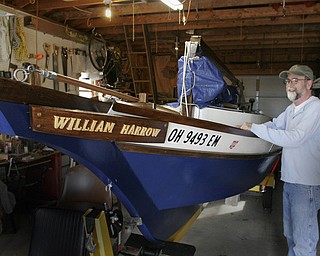 Bill Davis spent five years building the wooden sailboat William Harrow in the garage of his Girard home. He named the 19 foot boat for his grandfather. 