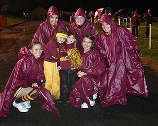 "Two elementary girls, Reagan Irons and Salli Dispenza, decided that
the rain wasn't so bad and came to the sidelines during the 3rd
quarter to cheer with the South Range cheerleaders.