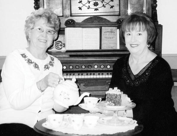 Special to The Vindicator
JUST TEA-SING: Prepared to serve after completing arrangements for a Victorian Christmas High Tea on Nov. 8 at the Strock Stone House are, from left, Joyce Pogany, president of Austintown Historical Society, and Marge Goldner, co-chair of the event, 