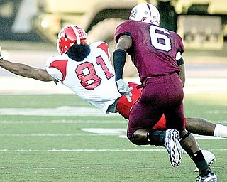 LOOKING AHEAD: Youngstown State’s Donald Jones (81) reaches for a pass while being watched by Southern Illinois’ Brandon Williams (6) during the Salukis’ 27-8 win over the Penguins on Saturday in Carbondale. The Penguins are preparing to take on South Dakota State this Saturday.
