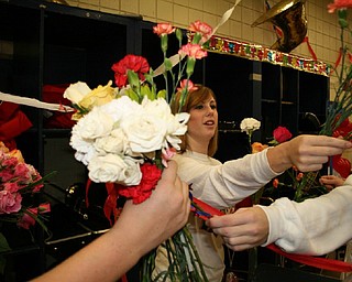 The Fitch Seniors' tradition of exchanging flowers before their last home game is carried on by Sami Ragan. 
