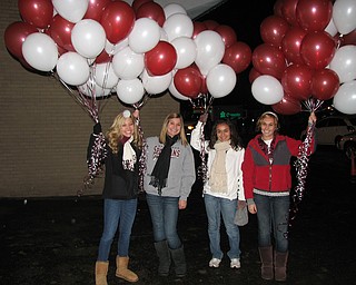 SPARTAN SPIRIT:  Boardman Freshman cheerleaders Lyndsay Olenych, Jaclyn Jones, Angela Parillo, and Rylie Jarrett getting ready for a varsity home game.