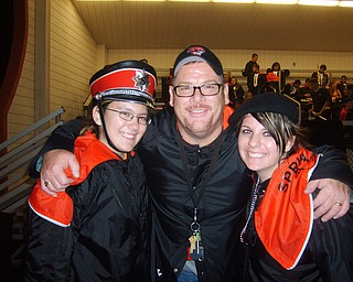 Senior Night: The Springfield Local marching band seniors take a moment for a picture with their band director. From left: Hannah McAndrew, director Matt Ferraro, and Katie Cozak.