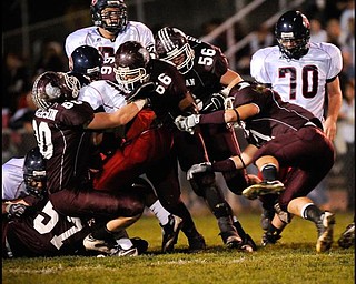 The Boardman defence sworm all over  Austintow's (13) Will Mahone during their game in Boardman on Friday night. Photo/Mark Stahl